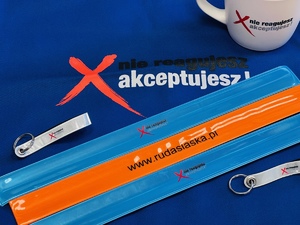 gadżety akcji nie reagujesz - akceptujesz - kubek, torba, odblaski