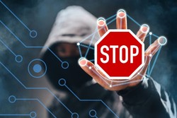 grafika z mężczyzną w kapturze bez twarzy i znakiem stop